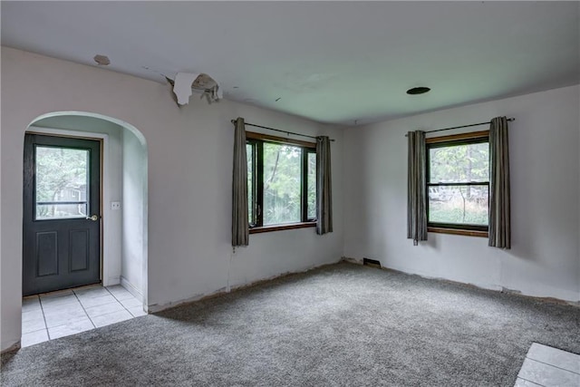 2561 86th St, Eau Claire, WI 54703 - tiled empty room with carpet and arched walkways