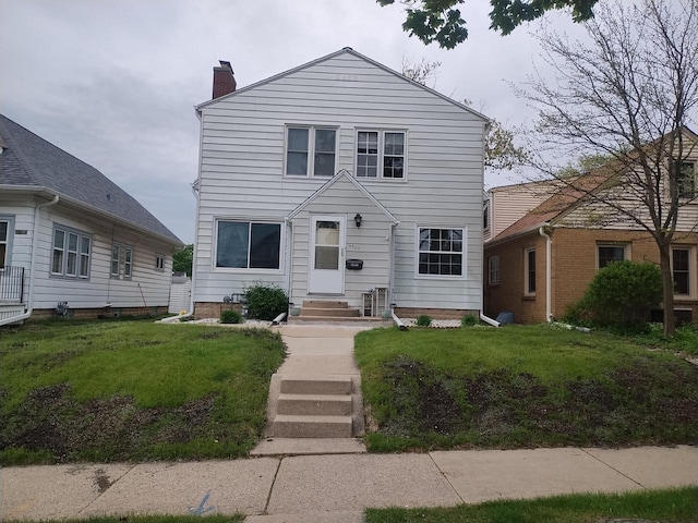 4507 S Griffin Ave, Milwaukee, WI 53207 - view of front of property featuring a chimney, entry steps, and a front lawn