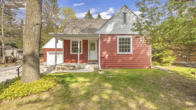 5515 Evergreen Dr, Sheboygan, WI 53081 - bungalow-style house with an attached garage, a front yard, and a shingled roof