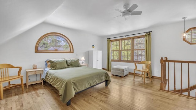 5515 Evergreen Dr, Sheboygan, WI 53081 - bedroom with multiple windows, light wood finished floors, lofted ceiling, and a ceiling fan