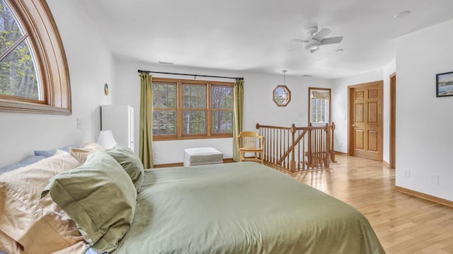 5515 Evergreen Dr, Sheboygan, WI 53081 - bedroom featuring light wood finished floors, baseboards, and a ceiling fan