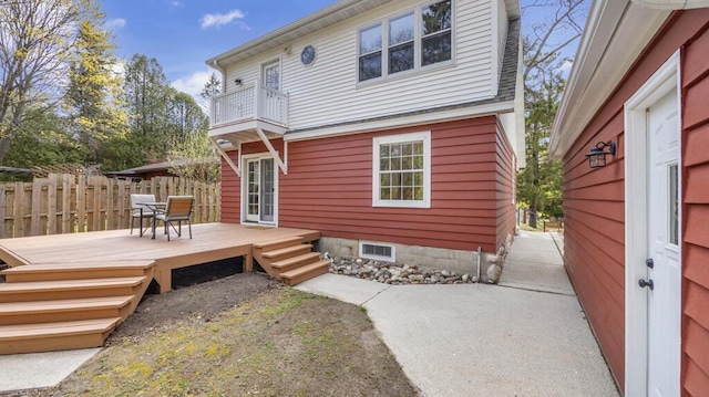 5515 Evergreen Dr, Sheboygan, WI 53081 - rear view of house featuring a balcony and a wooden deck