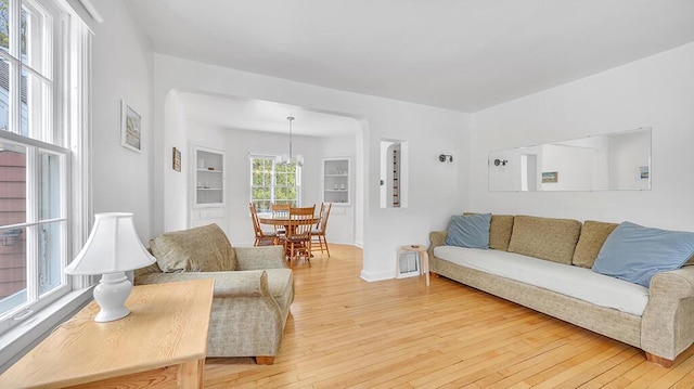 5515 Evergreen Dr, Sheboygan, WI 53081 - living room with light wood-type flooring, baseboards, and built in features