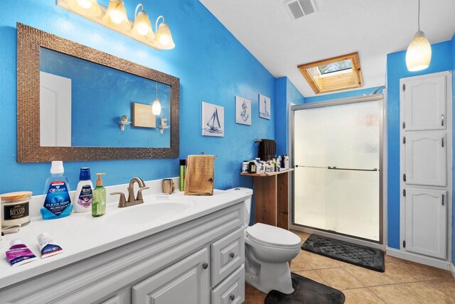 6560 US Highway 14, Arena, WI 53503 - full bath featuring a shower stall, vanity, a skylight, tile patterned flooring, and vaulted ceiling