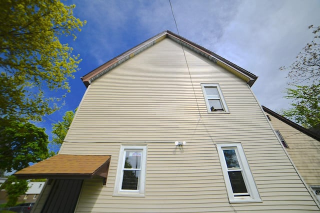2477 N 37th St Unit 2479, Milwaukee, WI 53210 - view of side of home featuring a gambrel roof