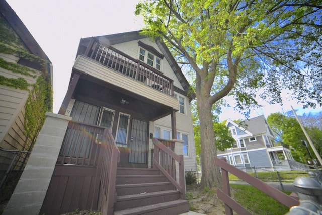 2477 N 37th St Unit 2479, Milwaukee, WI 53210 - view of front of house featuring a balcony and a porch