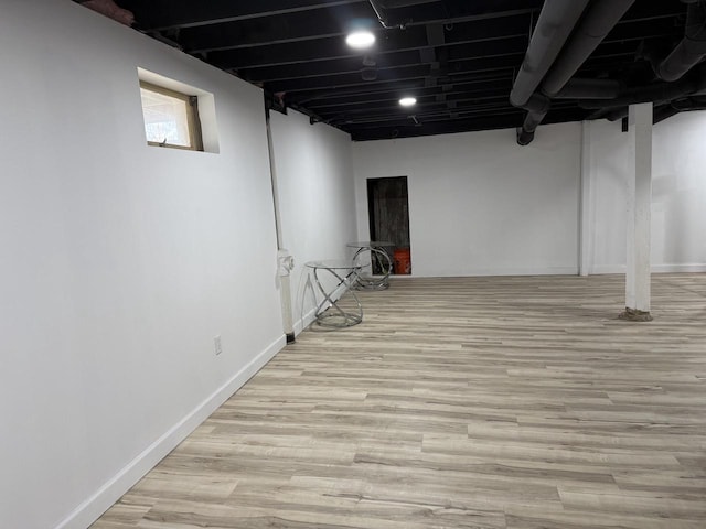 901 S 90th St, West Allis, WI 53214 - below grade area featuring wood finished floors and baseboards