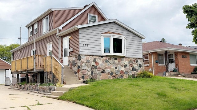 901 S 90th St, West Allis, WI 53214 - view of front of property featuring a front lawn and stone siding