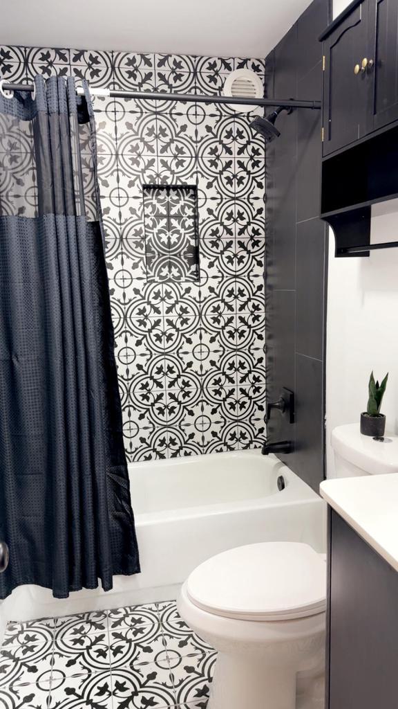 901 S 90th St, West Allis, WI 53214 - full bathroom with shower / tub combo, toilet, vanity, and tile patterned flooring