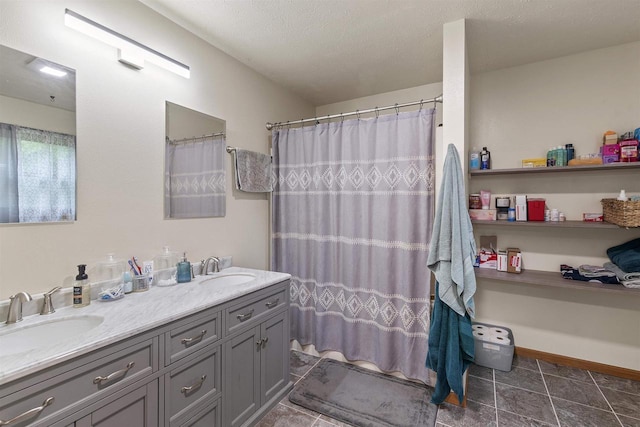 2150 E Carly Ct, Milton, WI 53563 - full bath with double vanity, a shower with shower curtain, and a textured ceiling
