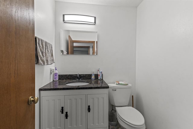 2150 E Carly Ct, Milton, WI 53563 - half bathroom featuring vanity and toilet