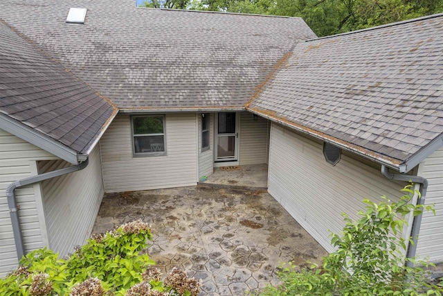 2150 E Carly Ct, Milton, WI 53563 - entrance to property featuring a patio area and roof with shingles