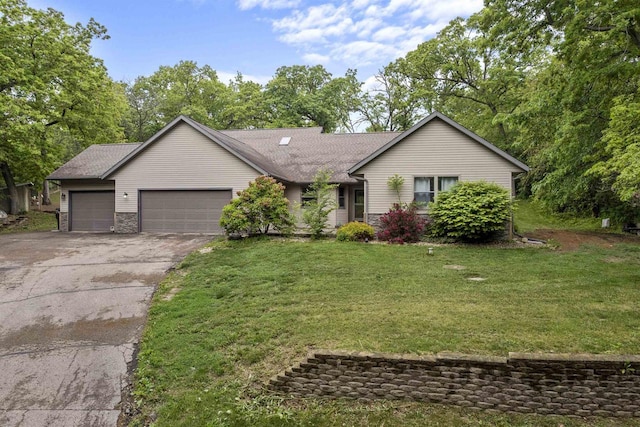 2150 E Carly Ct, Milton, WI 53563 - ranch-style house with a garage, driveway, a front yard, and a shingled roof