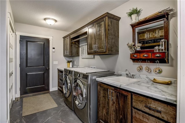 4567 Springfield Dr, Eau Claire, WI 54701 - washroom with cabinet space, washer and clothes dryer, dark marble finish flooring, a textured ceiling, and baseboards