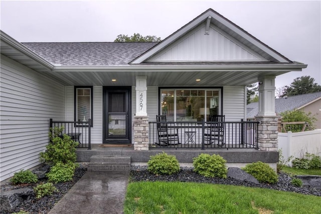 4567 Springfield Dr, Eau Claire, WI 54701 - property entrance with a porch, board and batten siding, and a shingled roof
