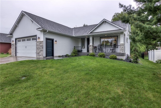 4567 Springfield Dr, Eau Claire, WI 54701 - view of front of home featuring a garage, a shingled roof, driveway, covered porch, and stone siding
