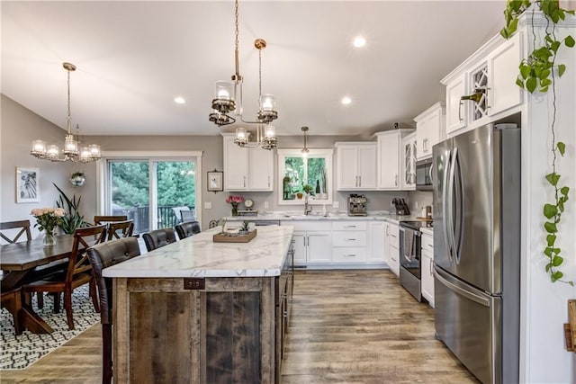 4567 Springfield Dr, Eau Claire, WI 54701 - kitchen featuring stainless steel appliances, a chandelier, a sink, healthy amount of natural light, and recessed lighting