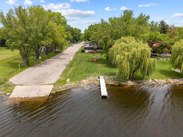 N3510 Lotus Dr, Montello, WI 53949 - dock featuring a lawn and a water view