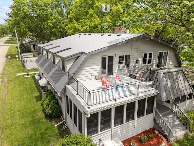 N3510 Lotus Dr, Montello, WI 53949 - back of property with a chimney, a yard, a balcony, and view of scattered trees