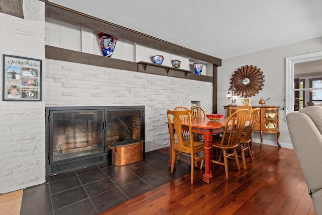 N3510 Lotus Dr, Montello, WI 53949 - dining room with a fireplace, wood finished floors, and brick wall