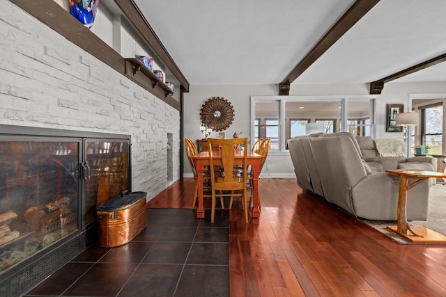 N3510 Lotus Dr, Montello, WI 53949 - dining area featuring beam ceiling, hardwood / wood-style floors, and a fireplace