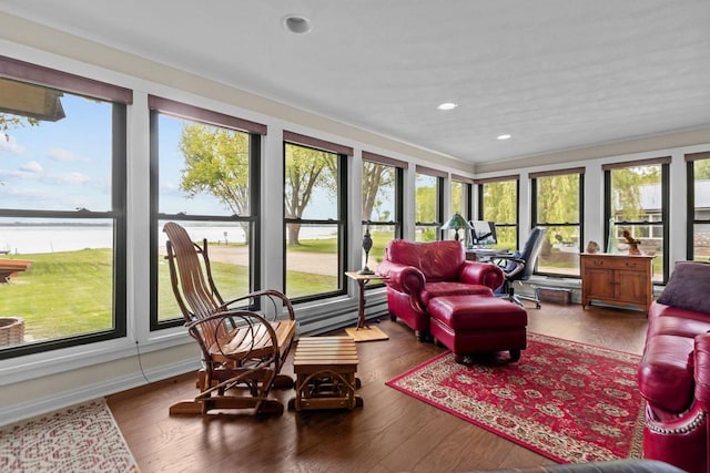 N3510 Lotus Dr, Montello, WI 53949 - sunroom / solarium featuring crown molding, a water view, wood finished floors, and recessed lighting