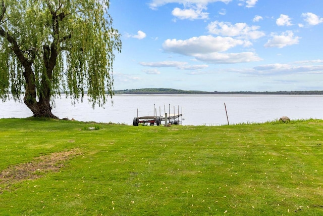 N3510 Lotus Dr, Montello, WI 53949 - dock area with a water view and a lawn