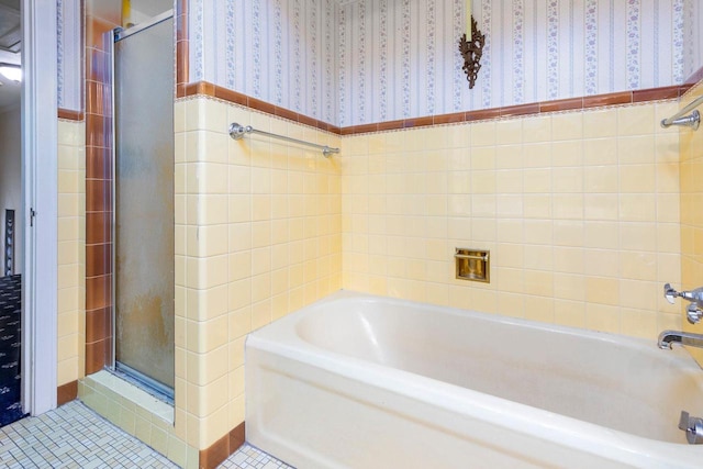 326 W Parkway Blvd, Appleton, WI 54911 - full bath featuring wallpapered walls, a shower stall, a garden tub, tile patterned flooring, and wainscoting