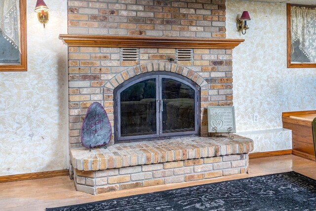 326 W Parkway Blvd, Appleton, WI 54911 - detailed view of wallpapered walls, wood finished floors, baseboards, and a fireplace