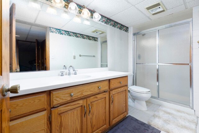 326 W Parkway Blvd, Appleton, WI 54911 - full bathroom featuring vanity, a shower stall, toilet, and a paneled ceiling