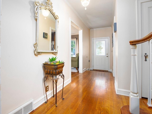 326 W Parkway Blvd, Appleton, WI 54911 - entryway with wood finished floors, ornamental molding, baseboards, and stairs