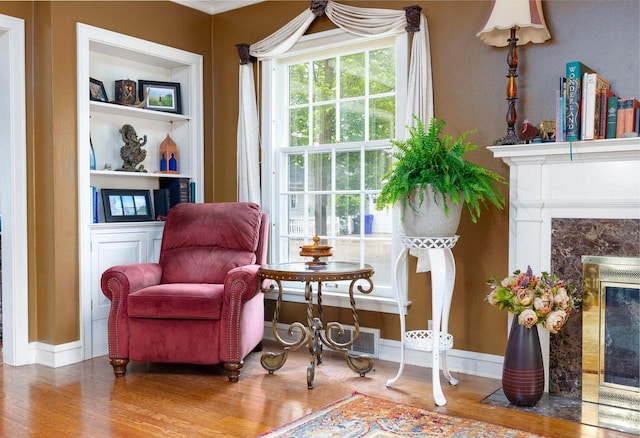 326 W Parkway Blvd, Appleton, WI 54911 - sitting room featuring wood finished floors, a premium fireplace, and baseboards