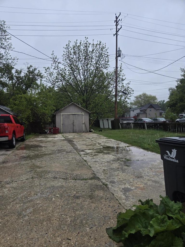 443 Dunbar Ave, Waukesha, WI 53186 - detached garage featuring a storage shed and concrete driveway