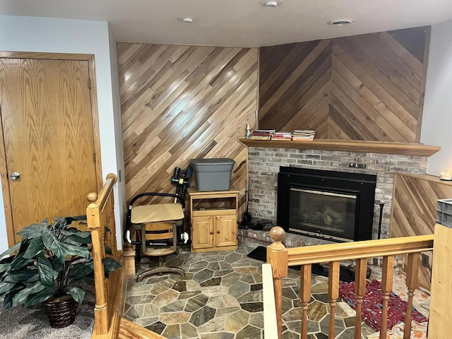1159 Elmhurst Ln, Oshkosh, WI 54904 - living area with a brick fireplace and wood walls