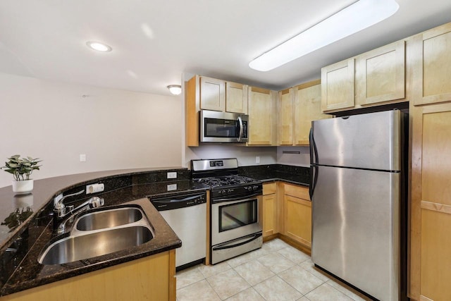 333 W Mifflin St Unit 8100, Madison, WI 53703 - kitchen featuring appliances with stainless steel finishes, a sink, a peninsula, light tile patterned flooring, and light brown cabinetry