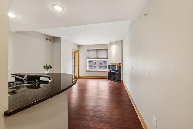 333 W Mifflin St Unit 8100, Madison, WI 53703 - hall featuring dark wood finished floors, baseboards, recessed lighting, and a sink