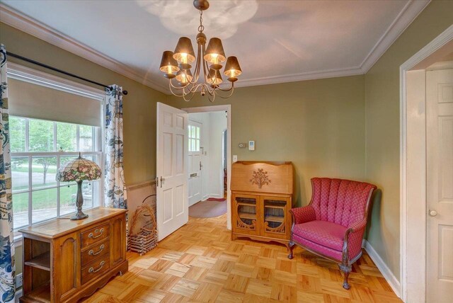 963 W Highland St, Whitewater, WI 53190 - living area with plenty of natural light, a chandelier, ornamental molding, and baseboards