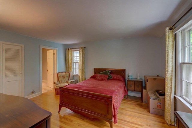 963 W Highland St, Whitewater, WI 53190 - bedroom with light wood-style flooring and baseboards