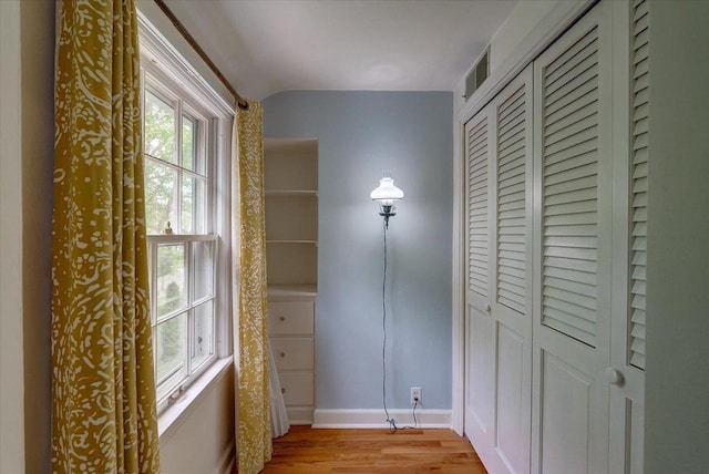 963 W Highland St, Whitewater, WI 53190 - interior space featuring light wood finished floors, baseboards, and vaulted ceiling