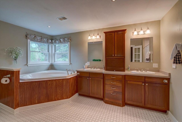 963 W Highland St, Whitewater, WI 53190 - full bath with double vanity, a bath, and tile patterned floors