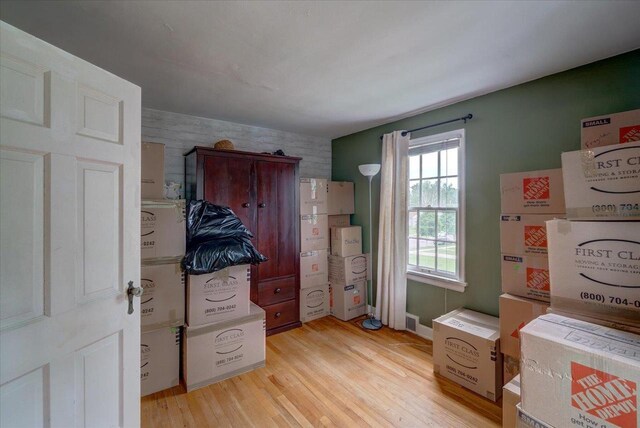 963 W Highland St, Whitewater, WI 53190 - entryway with light wood-style floors and an accent wall