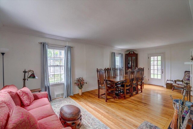 963 W Highland St, Whitewater, WI 53190 - dining room featuring ornamental molding and light wood-style floors