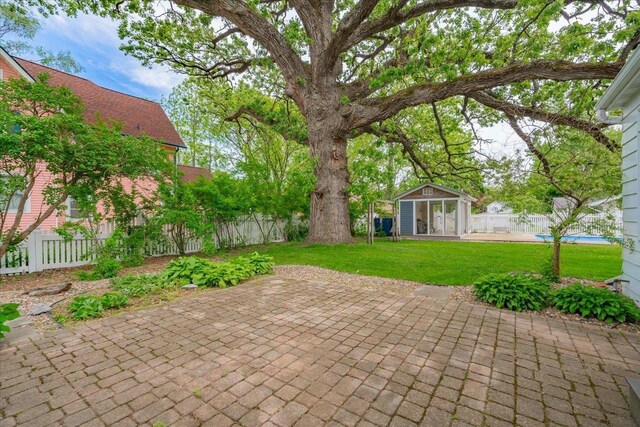 963 W Highland St, Whitewater, WI 53190 - view of patio / terrace with an outbuilding