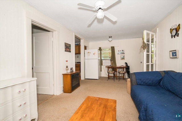 9298 E Park Ave, Solon Springs, WI 54873 - living room with light colored carpet, ceiling fan, cooling unit, and crown molding