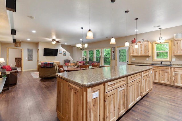 N9281 Perkins Rd, Mindoro, WI 54644 - kitchen with light brown cabinetry, a sink, open floor plan, dark wood-style flooring, and recessed lighting