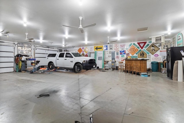 N9281 Perkins Rd, Mindoro, WI 54644 - garage featuring freestanding refrigerator