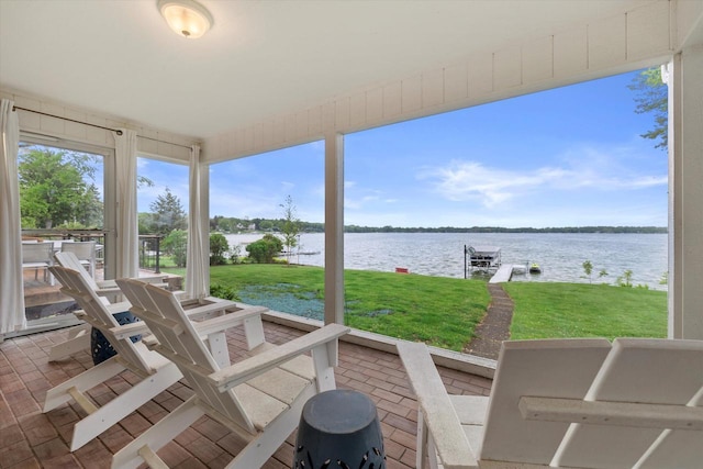 N60W39640 Mary Ln, Oconomowoc, WI 53066 - view of patio / terrace featuring a water view, a dock, and boat lift