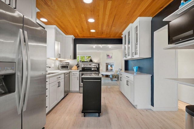 N60W39640 Mary Ln, Oconomowoc, WI 53066 - kitchen featuring stainless steel appliances, wooden ceiling, light countertops, light wood-style floors, and recessed lighting
