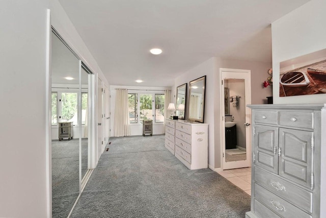 N60W39640 Mary Ln, Oconomowoc, WI 53066 - hallway with light colored carpet, recessed lighting, and light tile patterned floors