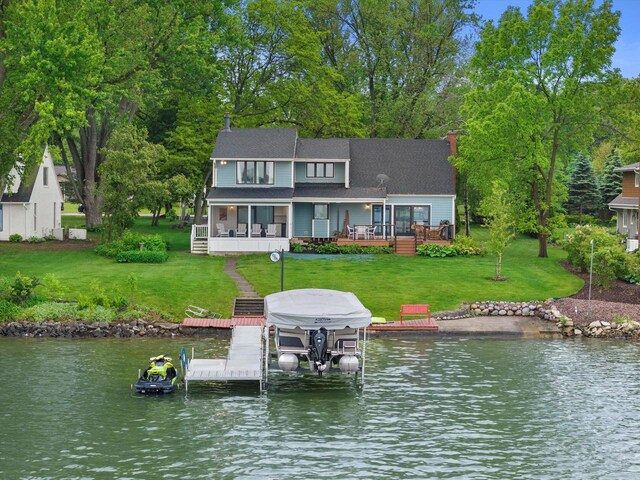 N60W39640 Mary Ln, Oconomowoc, WI 53066 - rear view of house featuring boat lift, a water view, and a yard